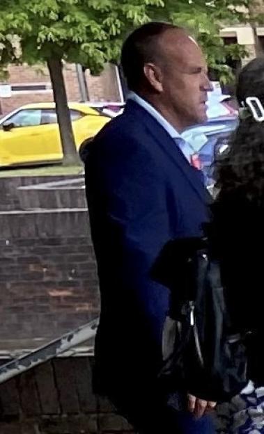 Man in suit outside Norwich Magistrates' Court.