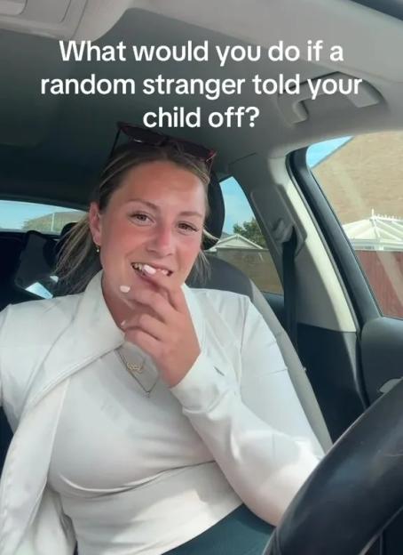 Woman in a car asks what others would do if a stranger scolded their child.