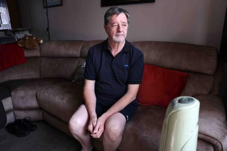 Man sitting on a couch.