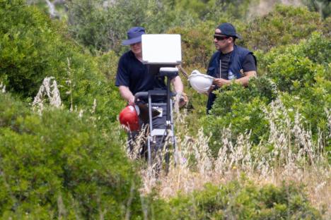 Police using radar equipment to search for evidence.