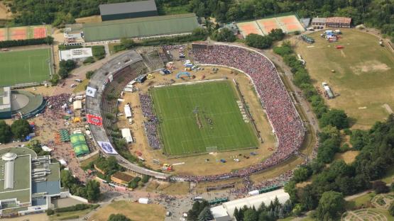 Aerial view of a crowded abandoned stadium.