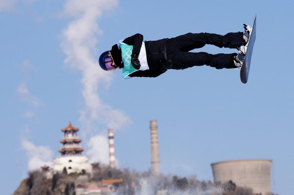 Anna Gasser of Austria performing a snowboard big air jump.