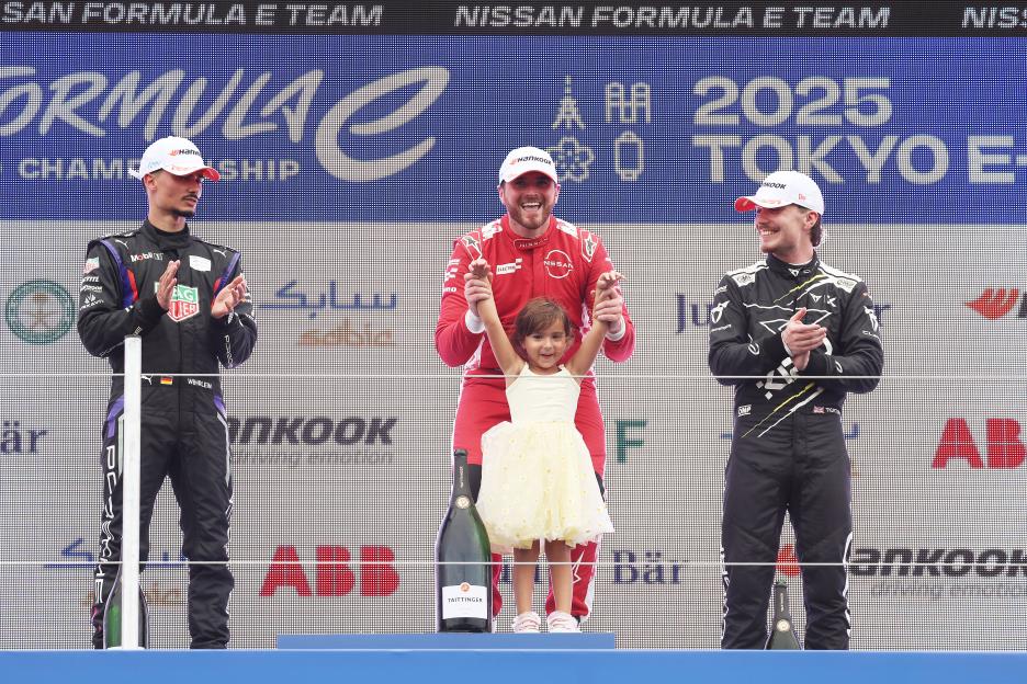 Formula E podium with race winner Oliver Rowland and his daughter.