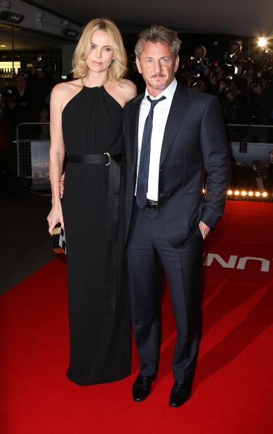 Sean Penn and Charlize Theron at a premiere.