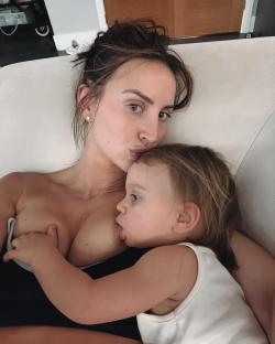 Woman breastfeeding a toddler.