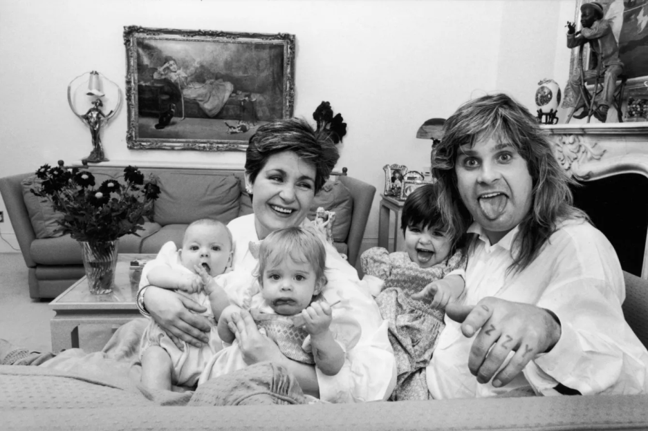 Black and white photo of a family with four young children.