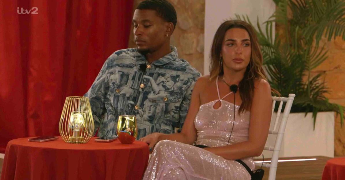 Screenshot of Love Island contestants sitting at a table.