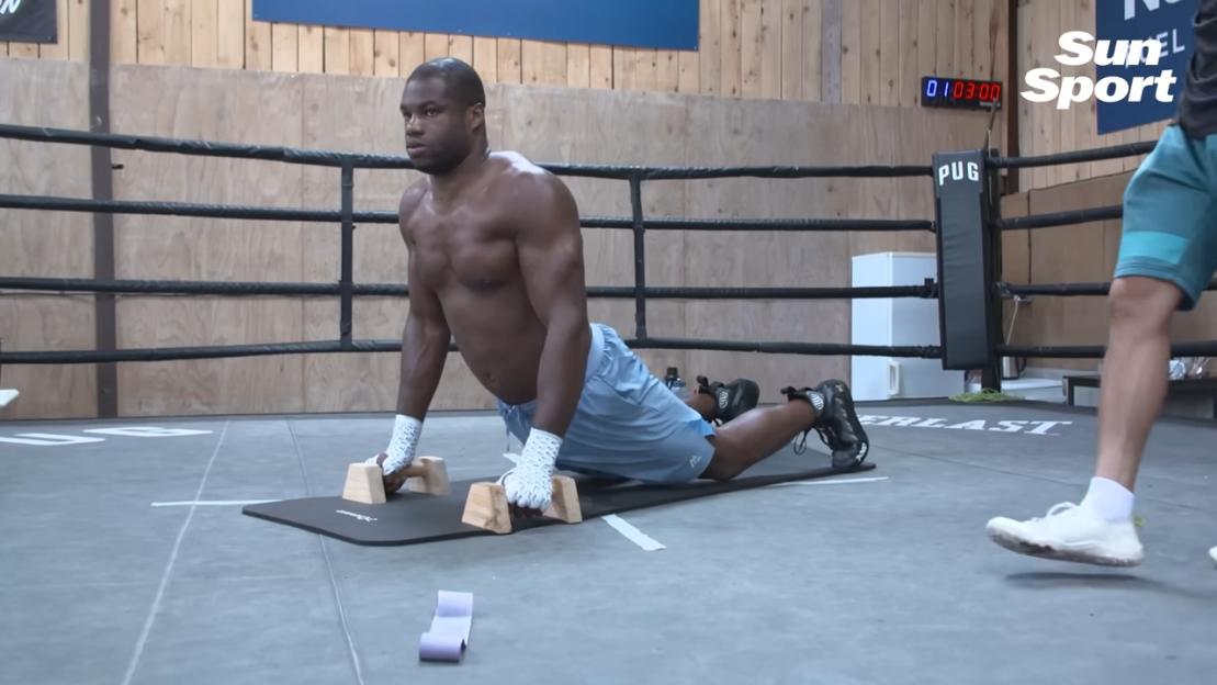 Boxer Daniel Dubois doing gymnastics training.
