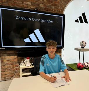 Camden Cesc Schaper signing an Adidas sponsorship deal.