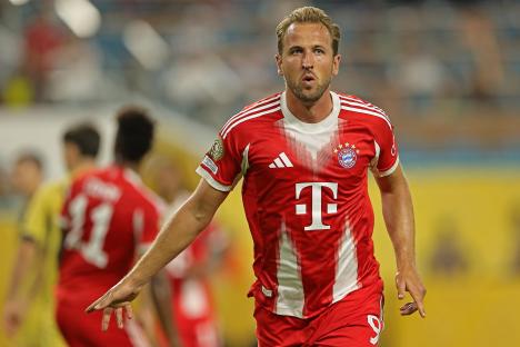 Harry Kane of FC Bayern Munich celebrating after scoring a goal.