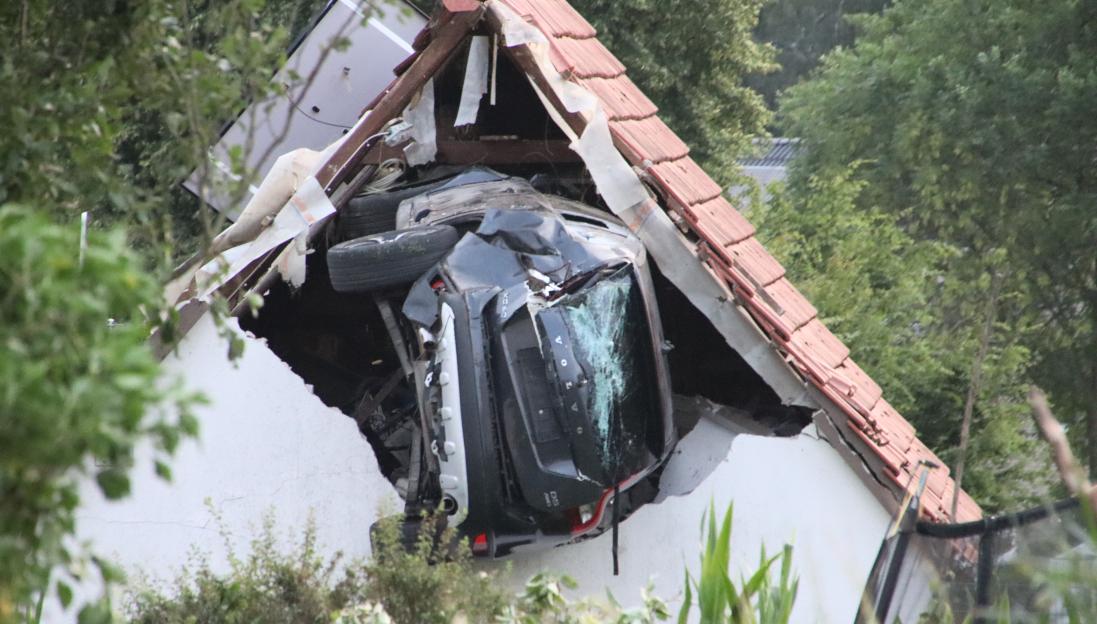 Car crashed into a barn.