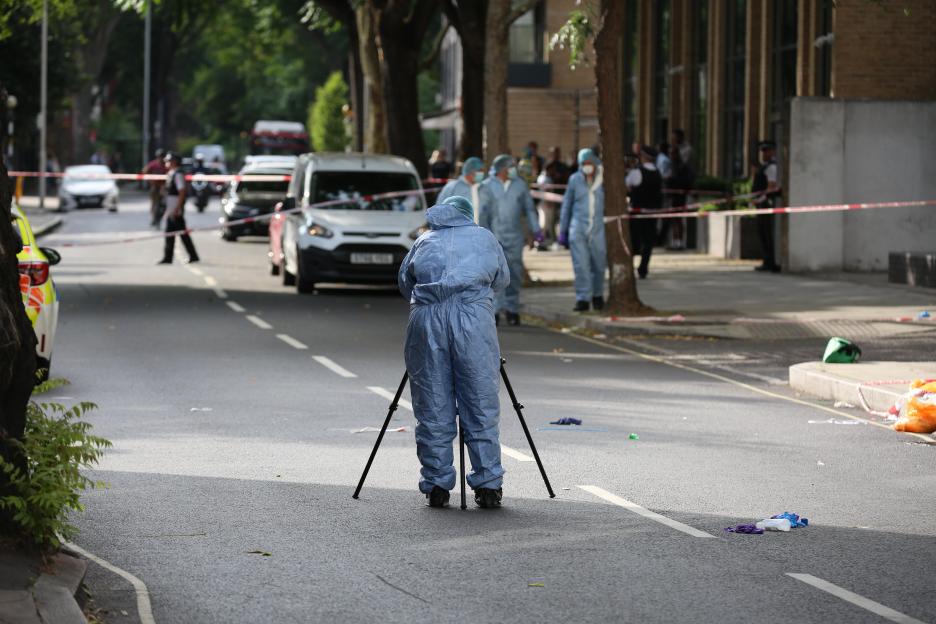 Forensic investigator at a crime scene.