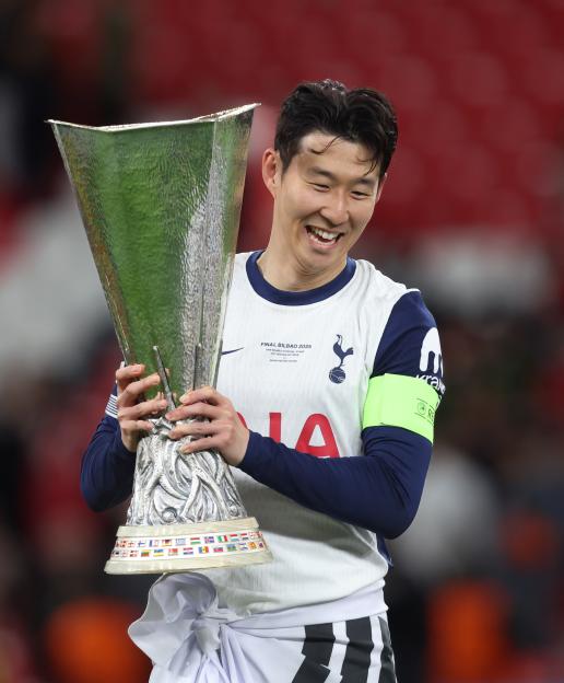 Son Heung-Min holding the UEFA Europa League trophy.