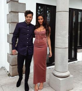 Marnie Simpson and her partner posing for a photo.
