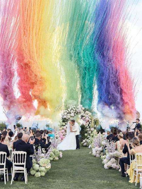 Wedding ceremony with rainbow smoke bombs.