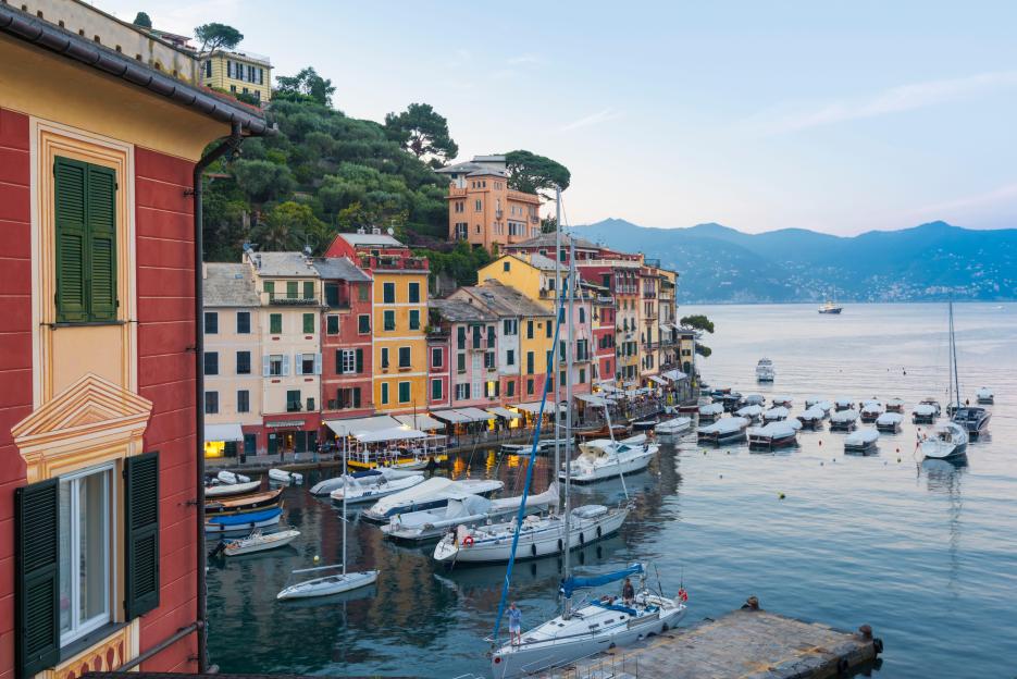 Portofino harbor in Liguria, Italy, with colorful buildings and boats.
