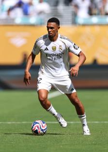 Trent Alexander-Arnold of Real Madrid dribbling the ball during a soccer match.