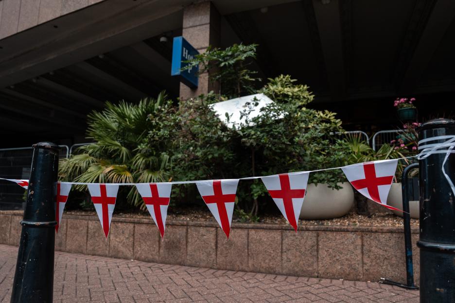Bunting with St. George's crosses outside a hotel.