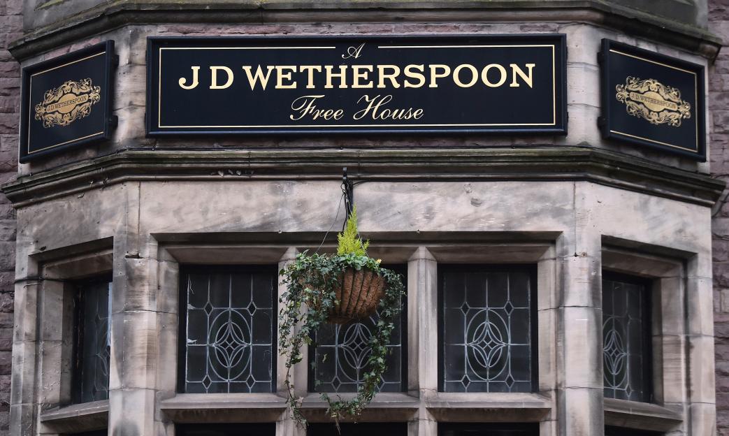 J D Wetherspoon Free House pub sign.