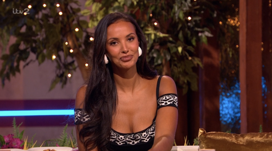 Screenshot of a woman sitting and talking.