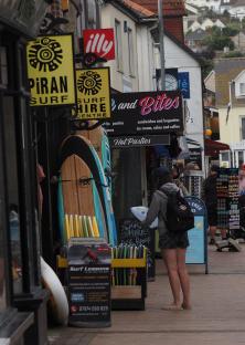 Tourist town with surf shops and cafes.