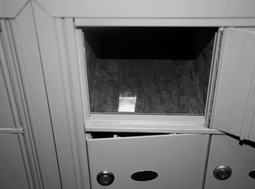 A small baggie in an open mail slot.
