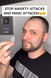 Man holding a small, translucent object, claiming it stops anxiety and panic attacks.