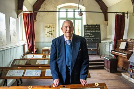 Peter Wellman, the last resident of Tyneham, in his former schoolroom.