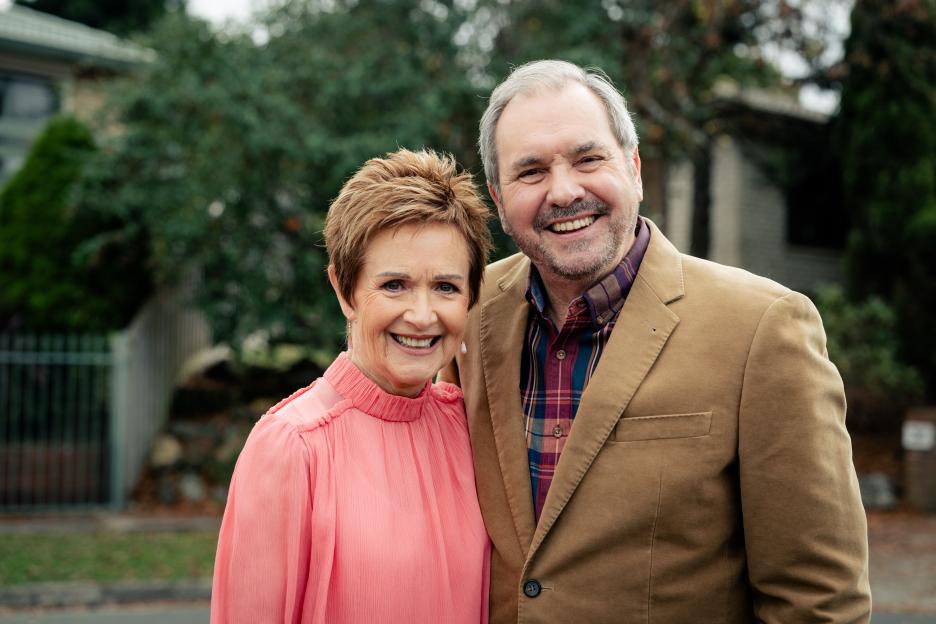 Portrait of a smiling older couple outdoors.