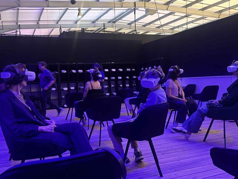 People wearing VR headsets in a room.