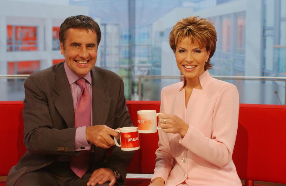 Dermot Murnaghan and Natasha Kaplinsky on the BBC Breakfast set, holding mugs.