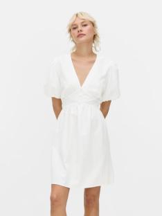 Woman in a white short-sleeved dress.