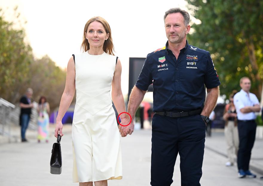 Christian Horner and Geri Horner holding hands.