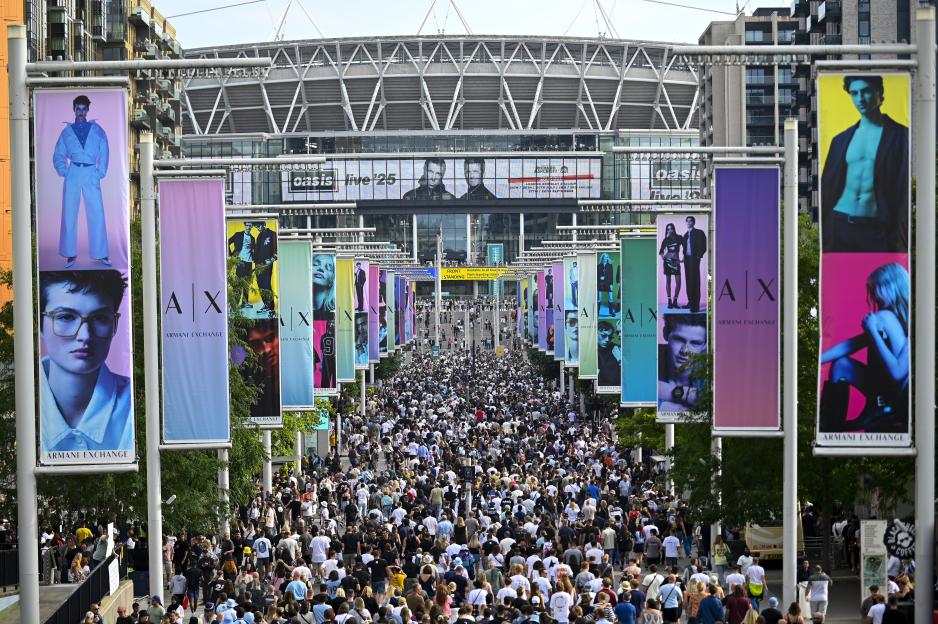 Crowd of Oasis fans arriving at Wembley Stadium.