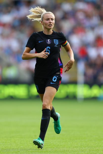 Leah Williamson of England Women's national team running on the field.