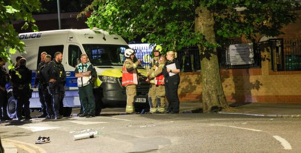 Emergency responders at a stabbing scene.
