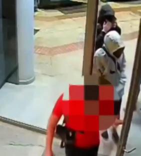 Surveillance footage of masked individuals freeing a prisoner.