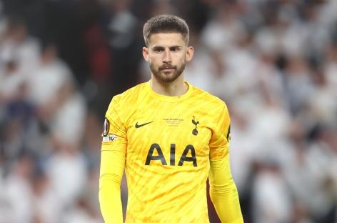 Guglielmo Vicario, Tottenham Hotspur goalkeeper, in yellow uniform.