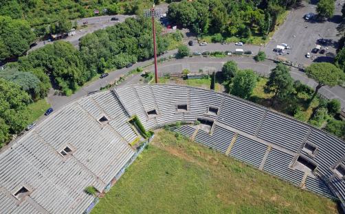 Aerial view of Flaminio Stadium in Rome, Italy, showing the overgrown and vandalized stands.