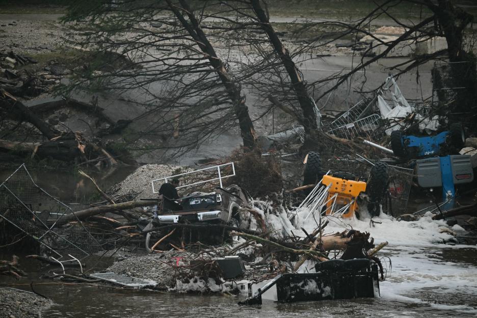 A photo shows overturned vehicles and broken trees after flooding caused by a flash flood at the Guadalupe River in Kerrville, Texas, on July 5, 2025. Rescuers were desperately searching for at least 20 girls missing from a riverside summer camp, officials said on July 5, after torrential rains caused a