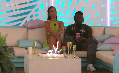 Malisha and Meg arguing on a Love Island couch.