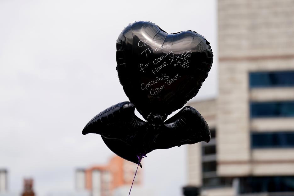 Black balloons with a message for Ozzy Osbourne.