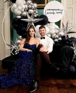 Couple posing at a SwingHub launch event.