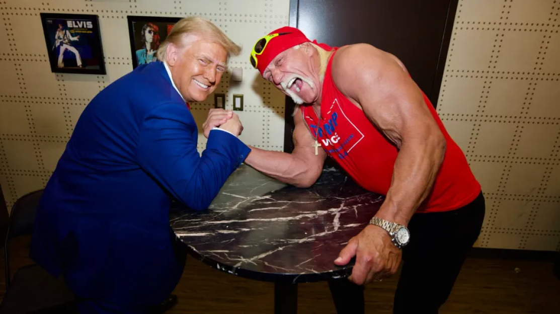 Donald Trump and Hulk Hogan arm wrestling.