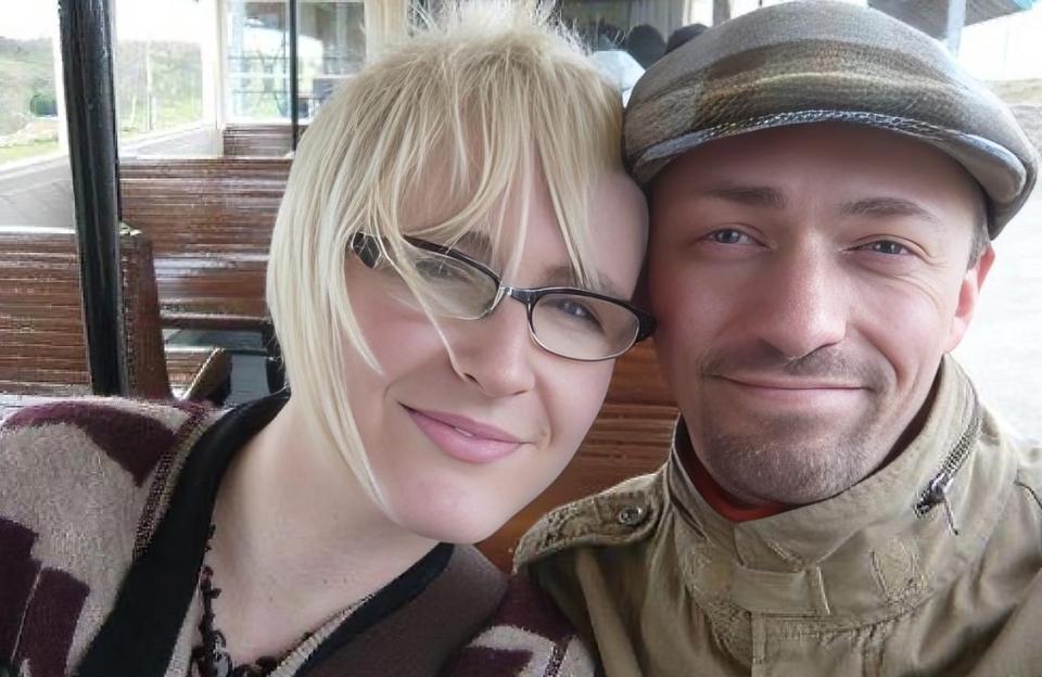 Couple smiling for a selfie.
