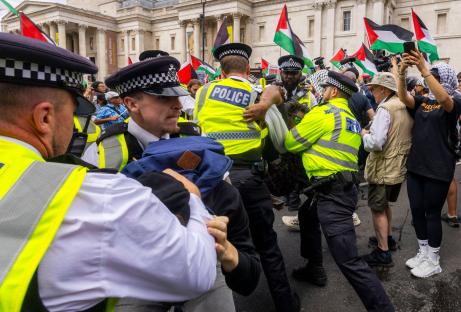 Police arresting a demonstrator at a Palestine Action protest.