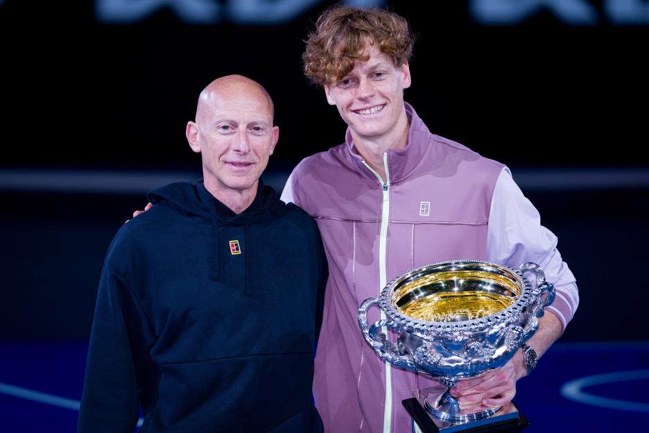 Jannik Sinner and his fitness coach Umberto Ferrara with the Norman Brookes Challenge Cup.