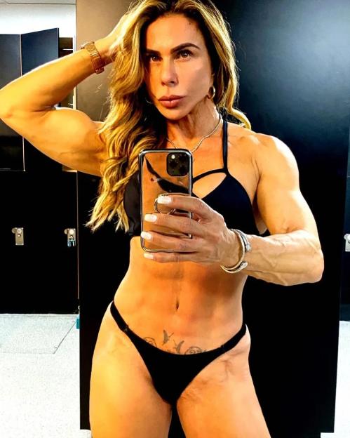 Andrea Sunshine taking a selfie in a gym locker room.