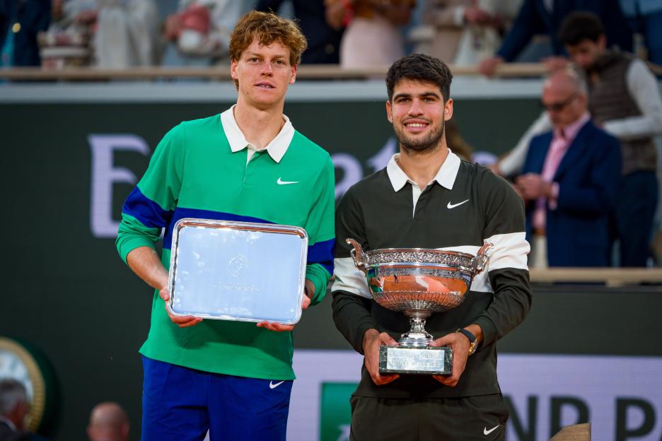 PARIS, FRANCE - JUNE 08: Carlos Alcaraz (R) of Spain poses with the Coupe des Mousquetaires trophy alongside runner-up Jannik Sinner of Italy following his victory in the Mens Singles Final match on Day Fifteen of the 2025 French Open at Roland Garros on June 08, 2025 in Paris, France (Photo by Andy Cheung/Getty Images)