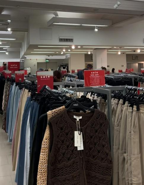 Shoppers browsing a Marks & Spencer sale.